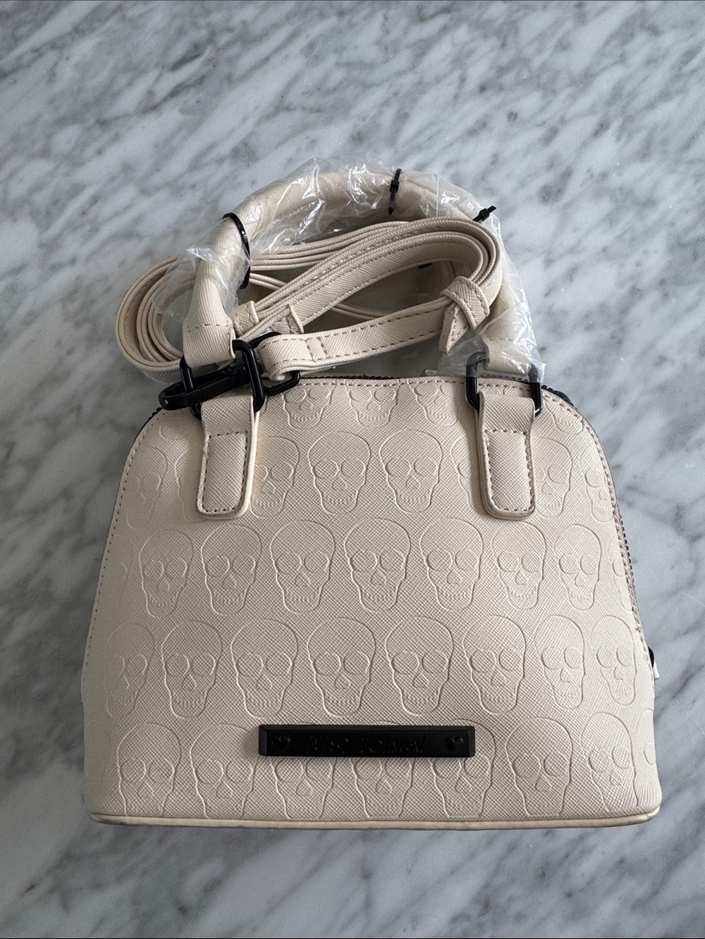 Betsey Johnson skull-embossed small satchel crossbody bag in cream/chalk. New.